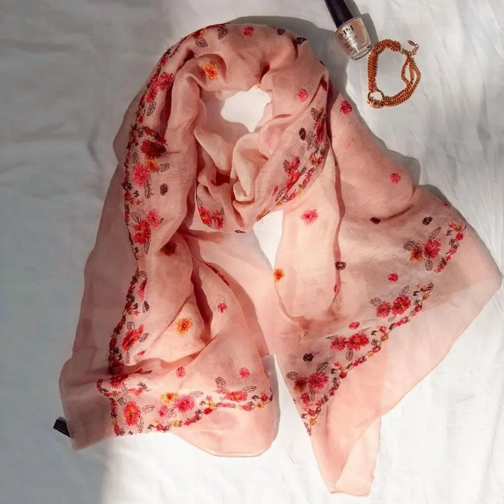 Light pink silk scarf featuring dainty floral embroidery