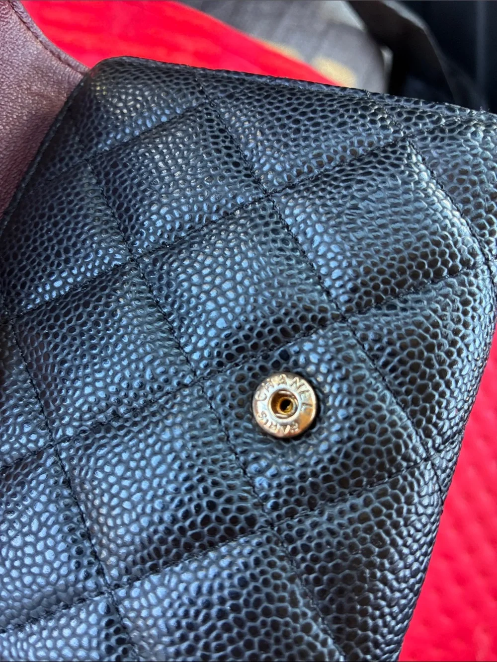 CHANEL leather snap