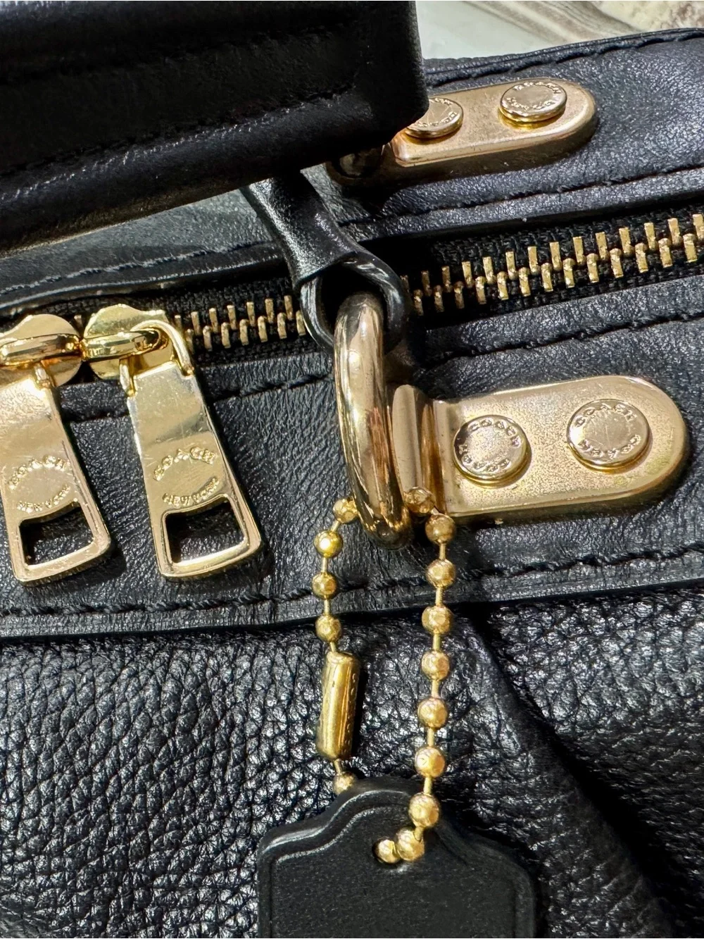 Coach polished pebble