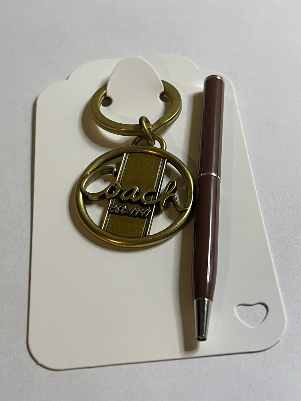 Coach gold tone