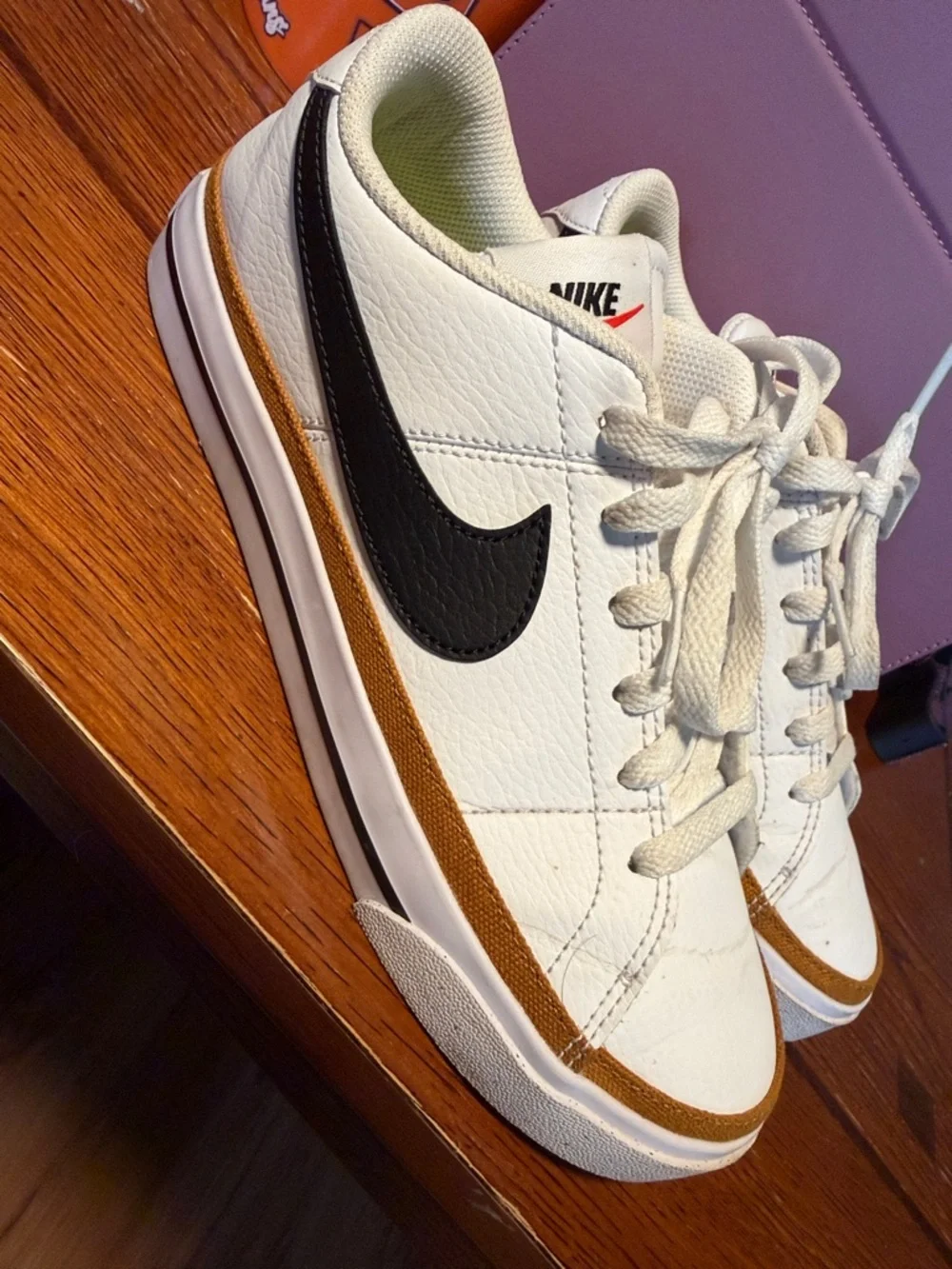 Nike Women’s White Leather Low-Top Sneakers with Black Swoosh
