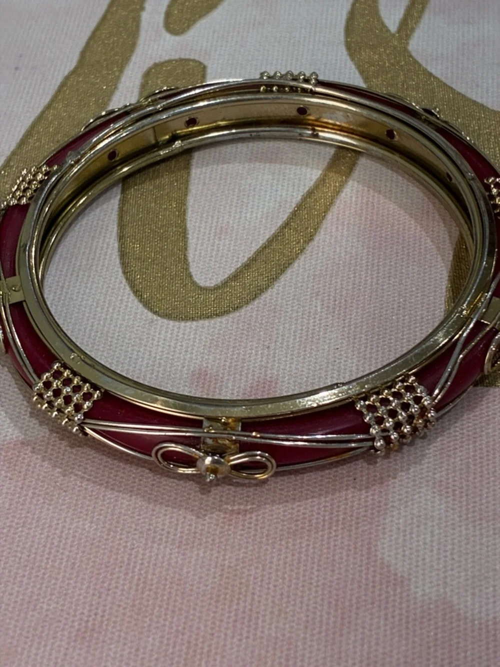 Gold-Tone Pink Enamel Bangle Bracelet with Bow Accent