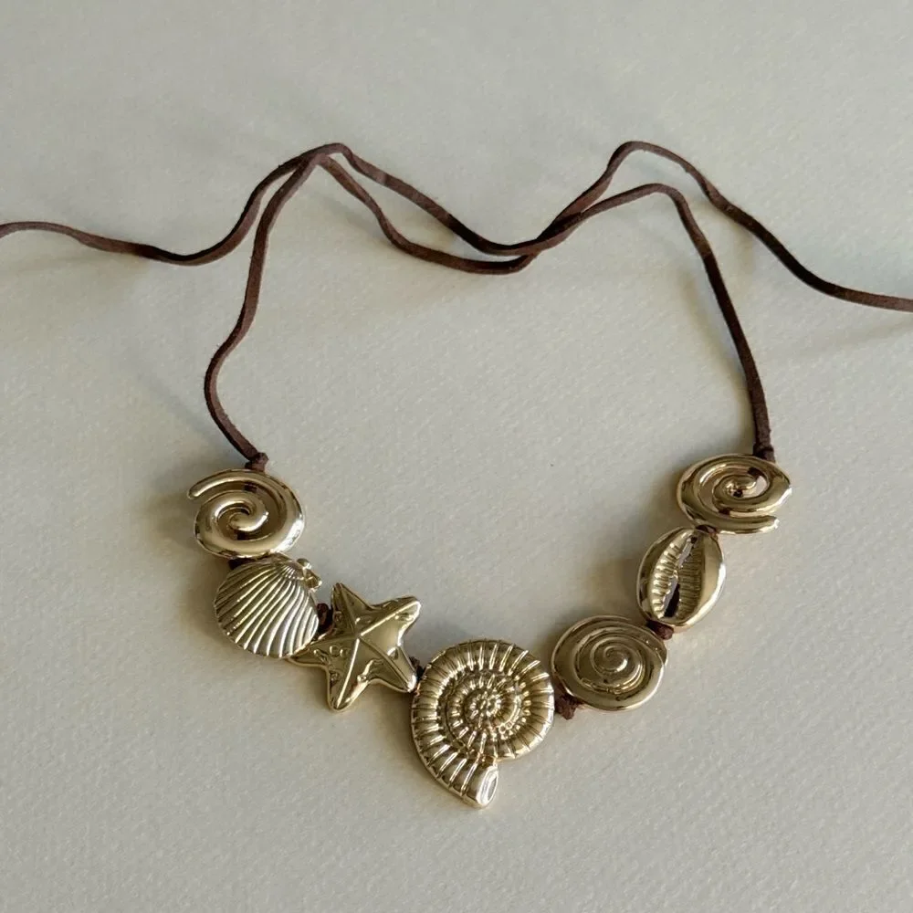 Anthropologie elegant gold