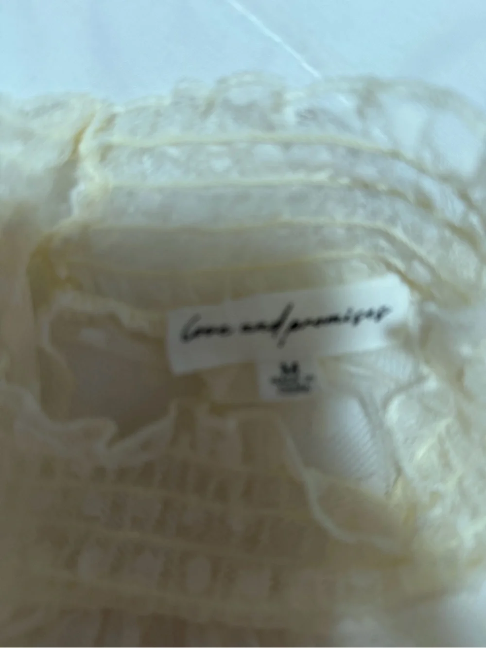Source Unknown sheer cream