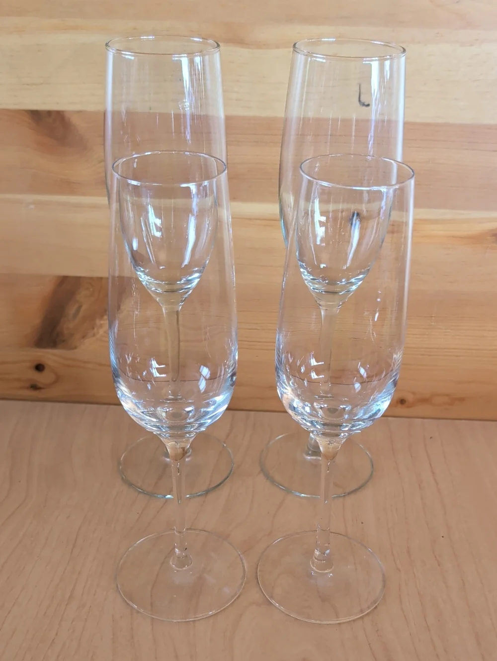 4 Clear Glass Champagne Flutes. 2 Tall & 2 Smaller.