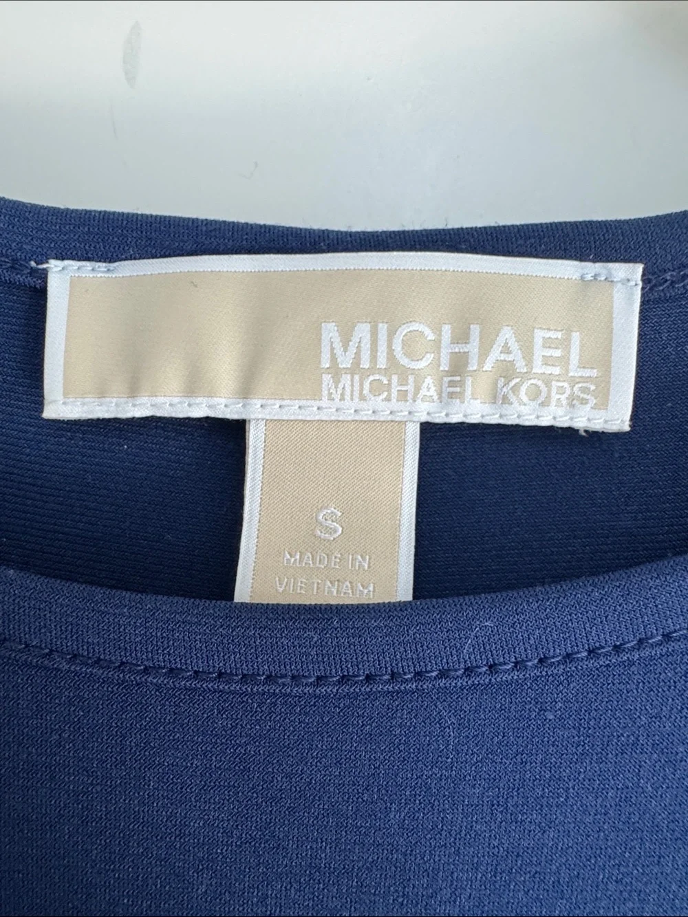 Michael Kors along stains