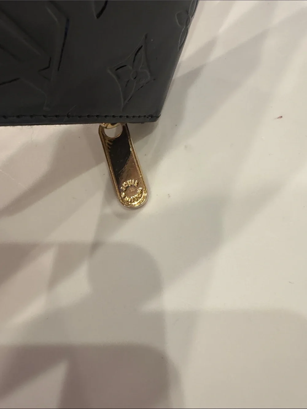 Louis Vuitton embossed lv