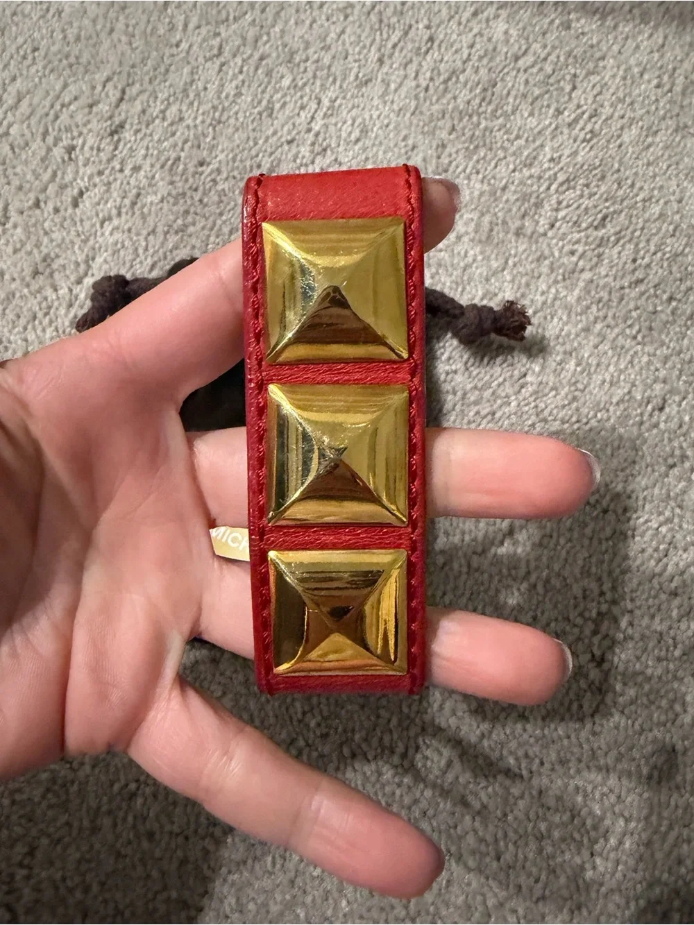 Michael Kors gold accessory
