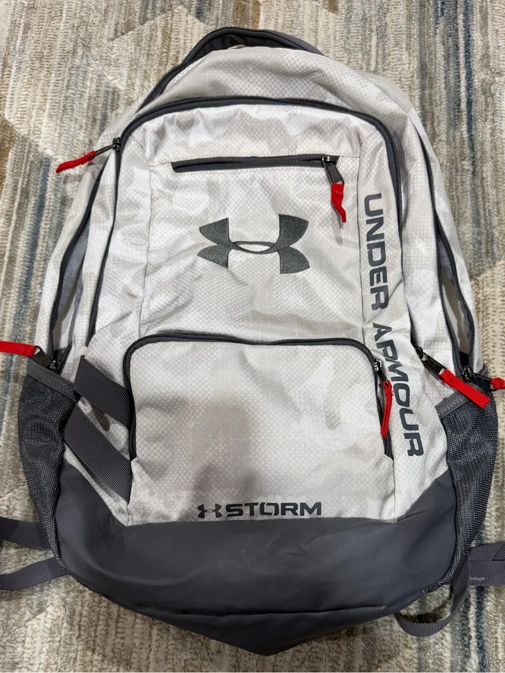 Under Armour Light Gray and Dark Gray Storm Backpack with Red Pulls