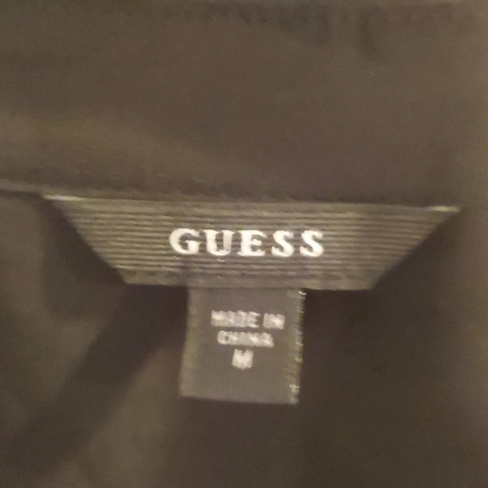 Guess button down