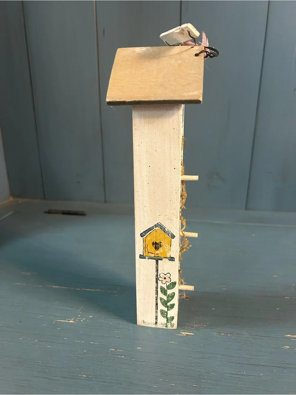 Hand Crafted White Birdhouse Wall Accent with Green Leaf and Pink Ribbon