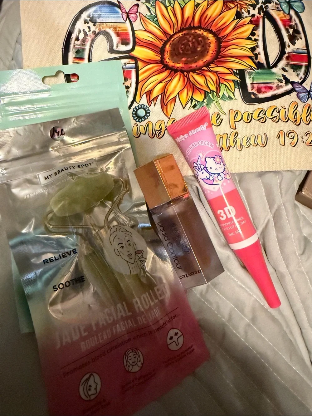 Jade Facial Roller + Pink Hello Kitty Lip Tint bag etc