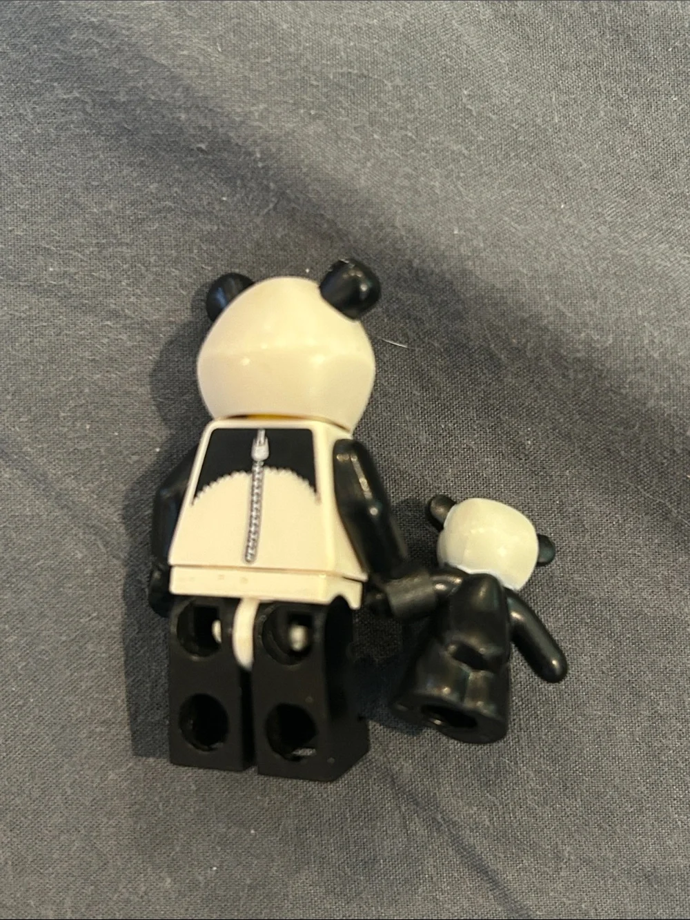Lego panda costume minifigure with teddy bear