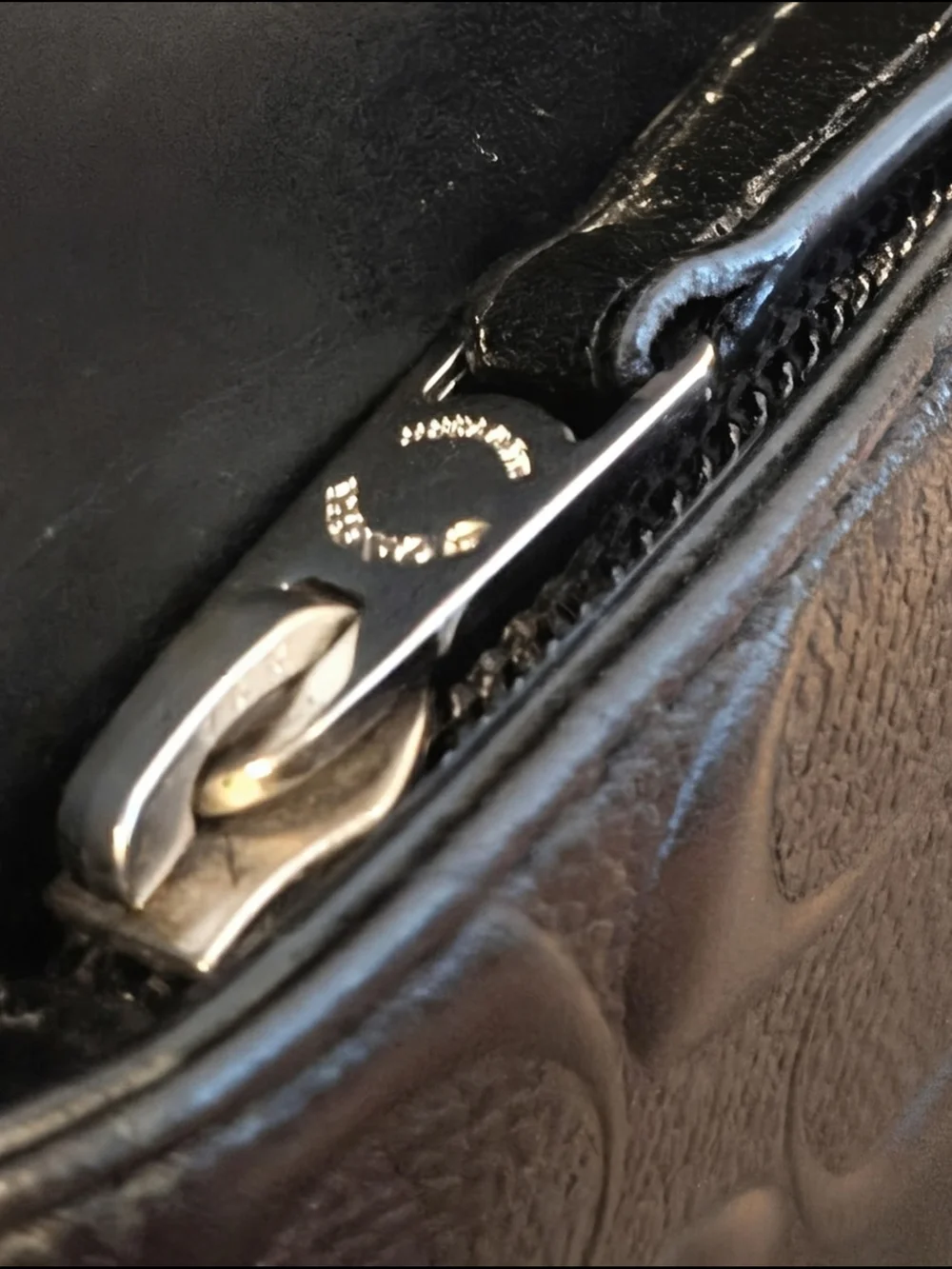 Coach sleek black
