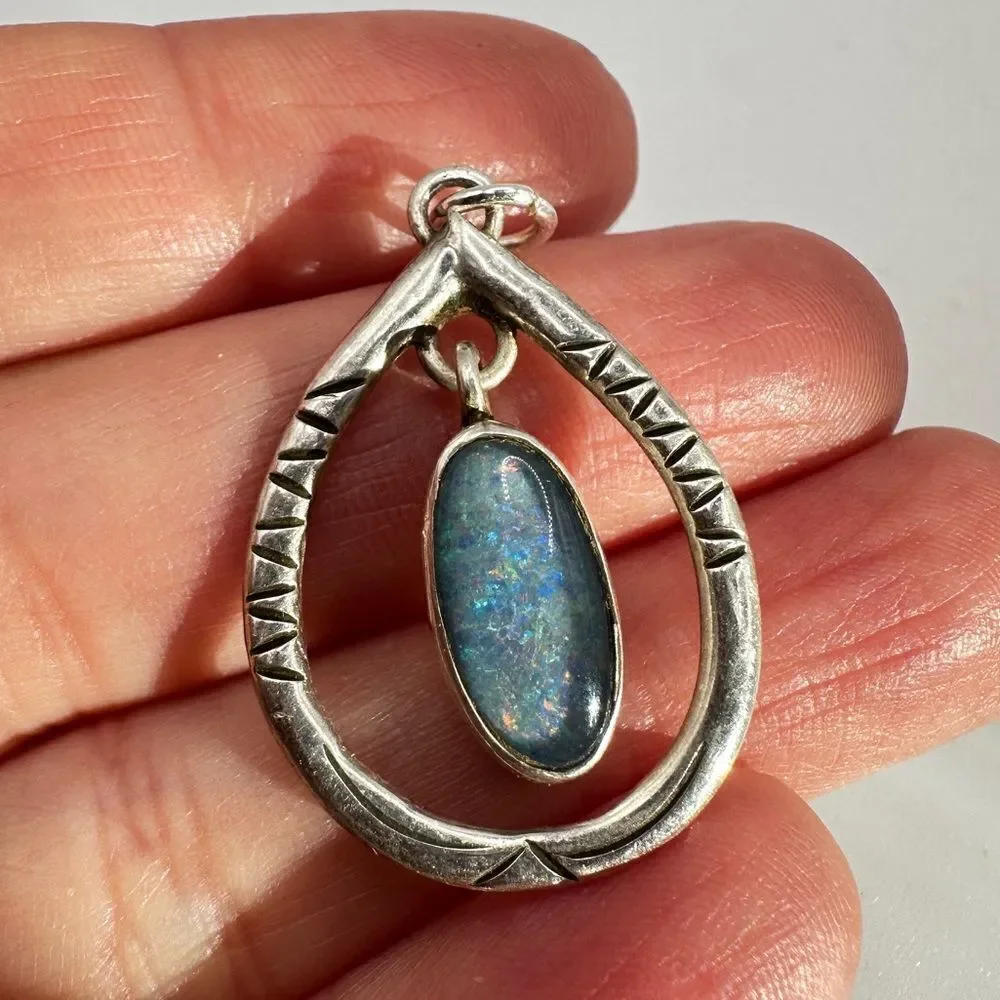 Marked Sterling‎ silver (HTS) and opal in resin pendant!