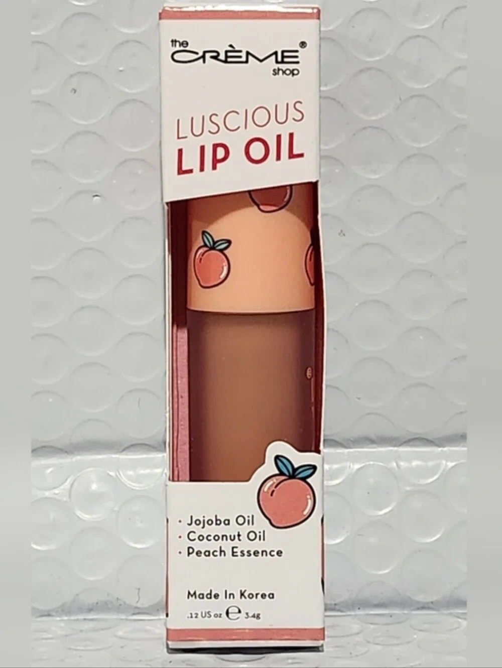 The Creme Shop Lucious Lip Oil in Peach Cobbler