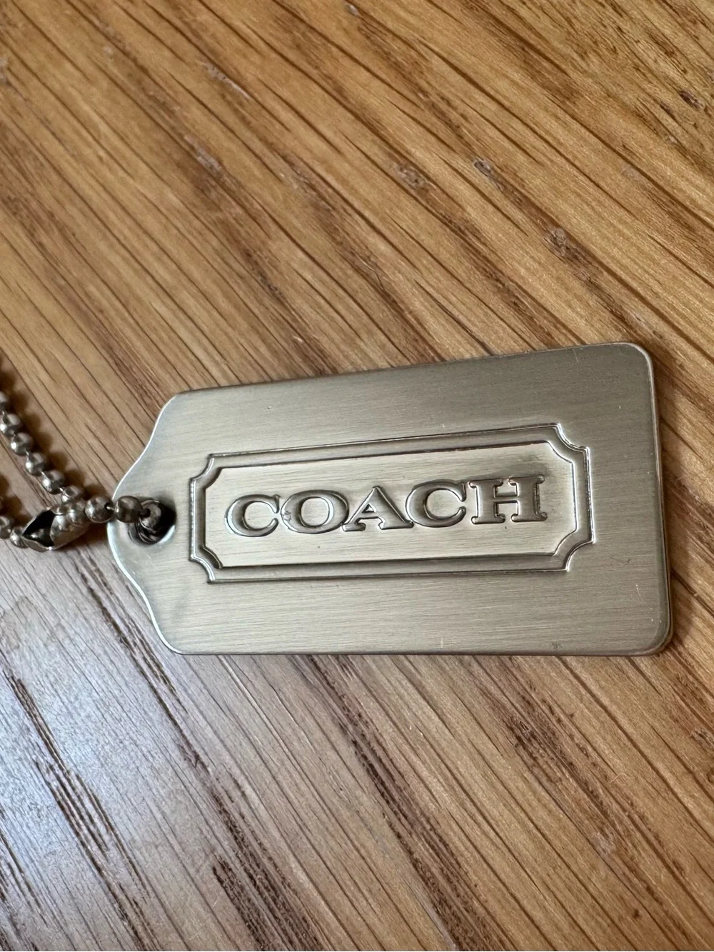 Coach hang tag