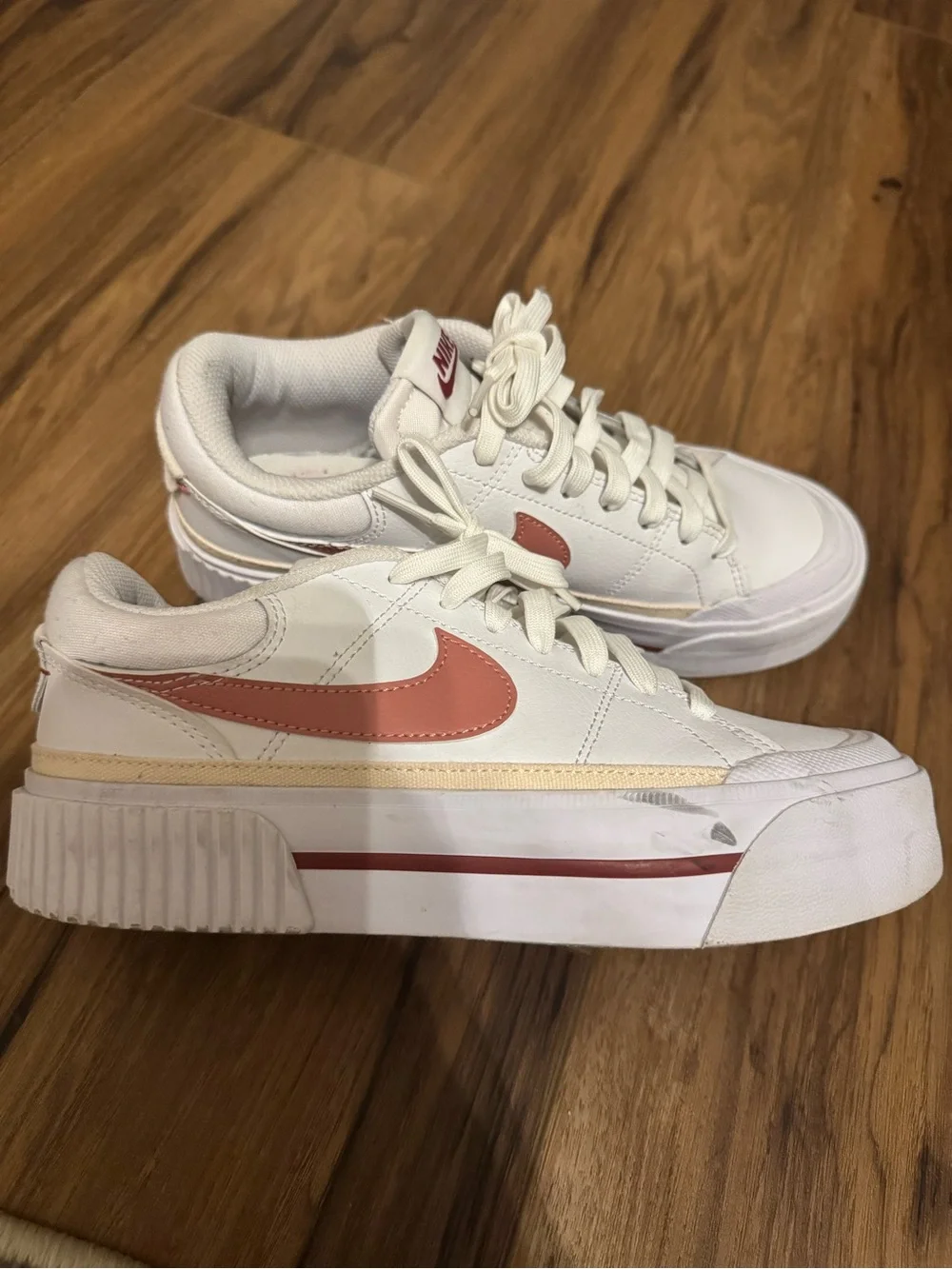 Nike Women’s White Sneakers with Rose Swoosh