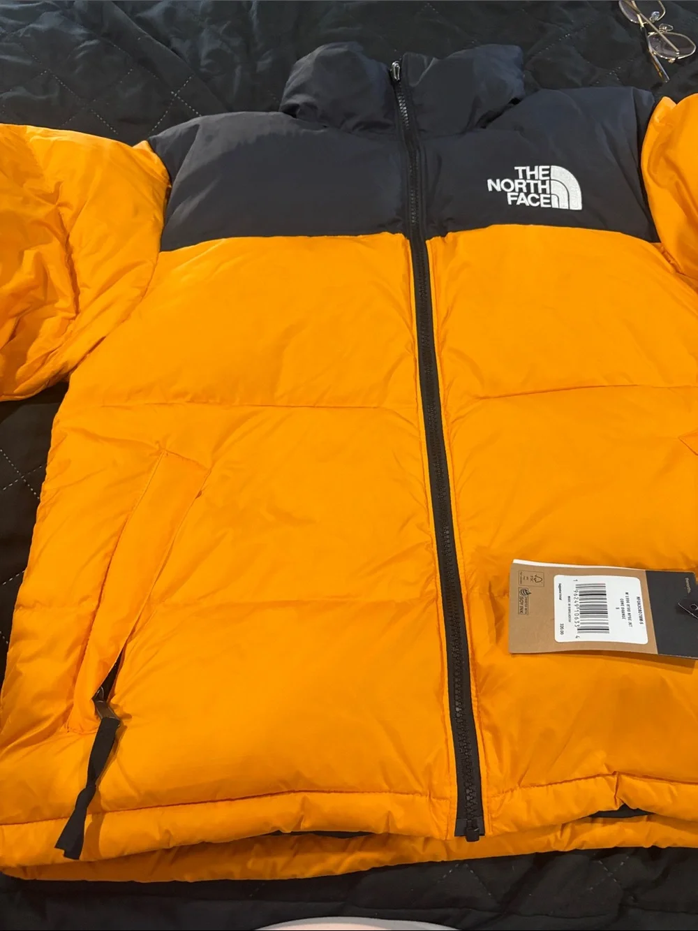 The North Face Men’s Orange and Black Puffer Jacket
