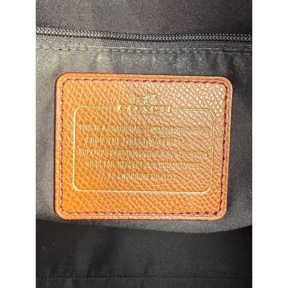 Coach •	material black