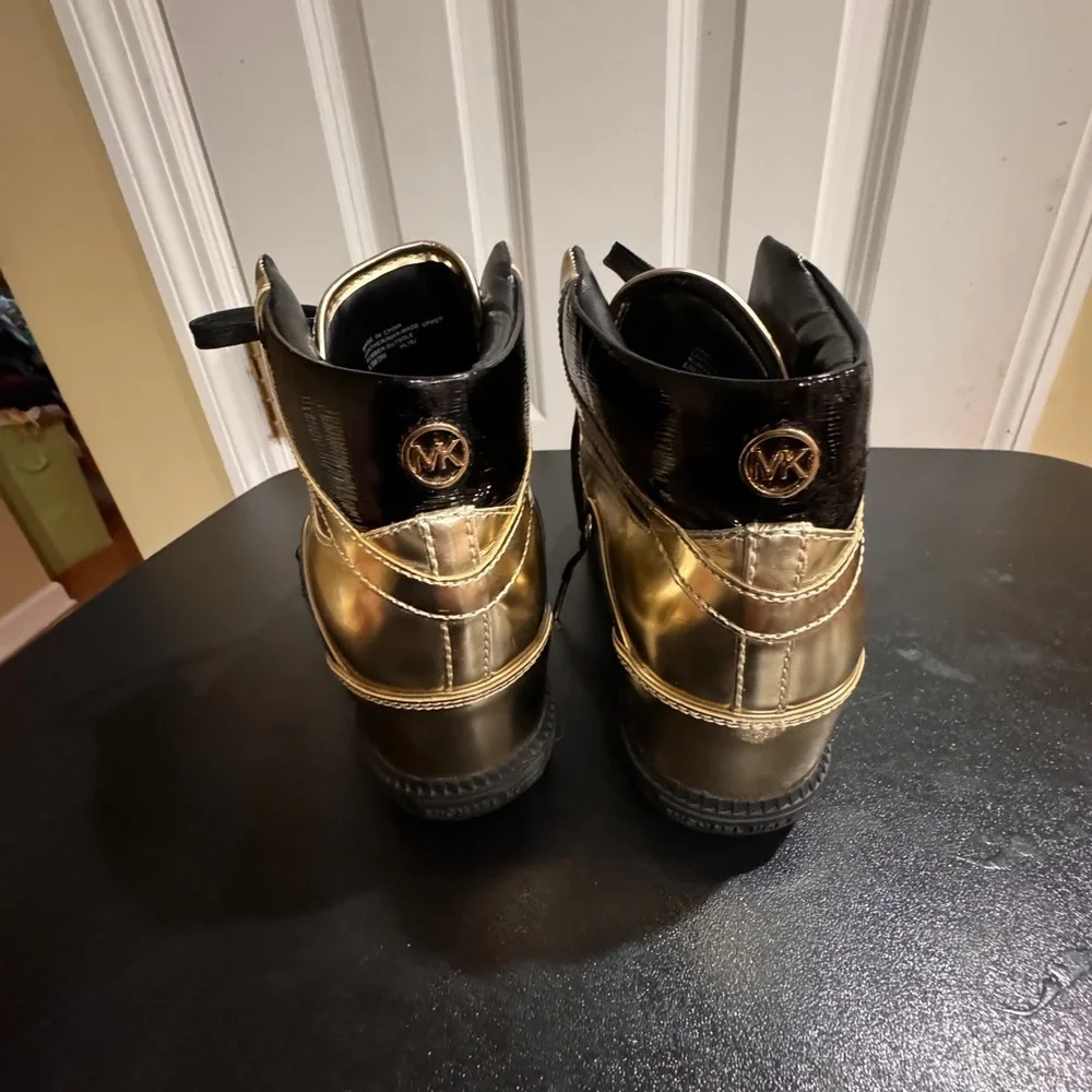 Michael Kors  size 8.5 Nikki black and gold high top sneakers