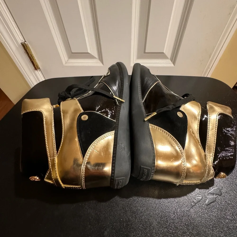 Michael Kors  size 8.5 Nikki black and gold high top sneakers