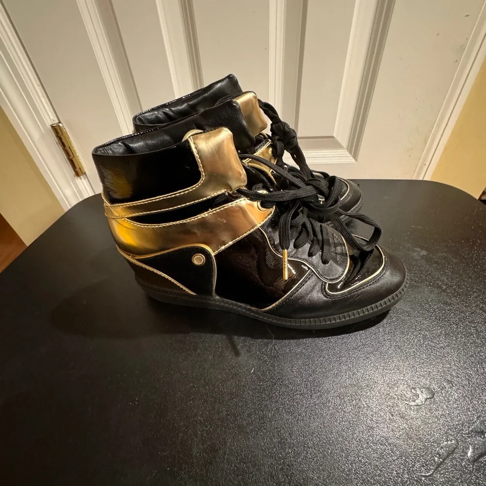 Michael Kors  size 8.5 Nikki black and gold high top sneakers
