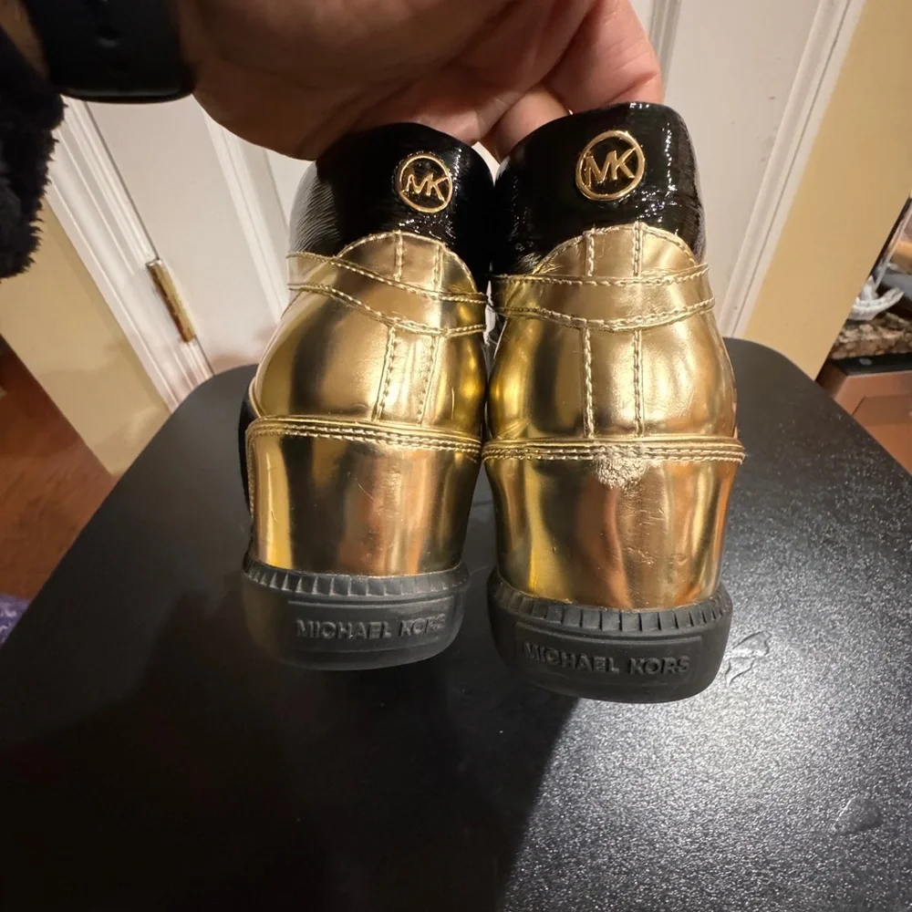 Michael Kors  size 8.5 Nikki black and gold high top sneakers