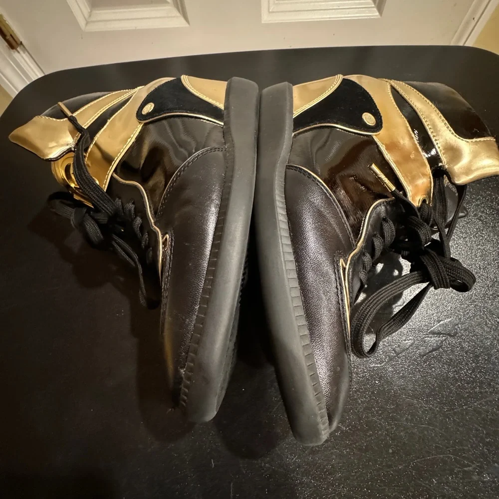 Michael Kors  size 8.5 Nikki black and gold high top sneakers
