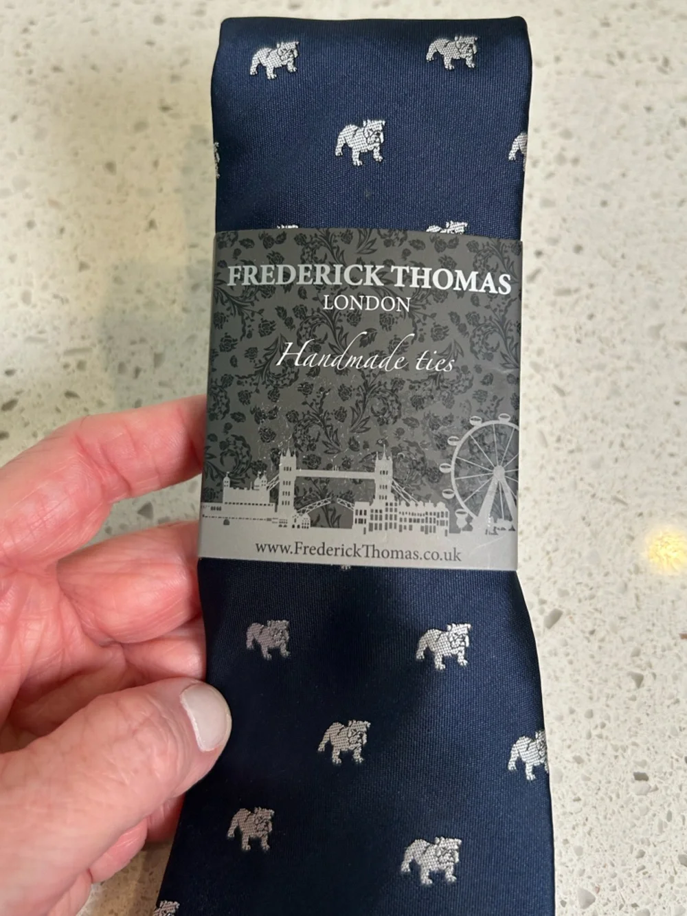 Frederick Thomas by navy necktie