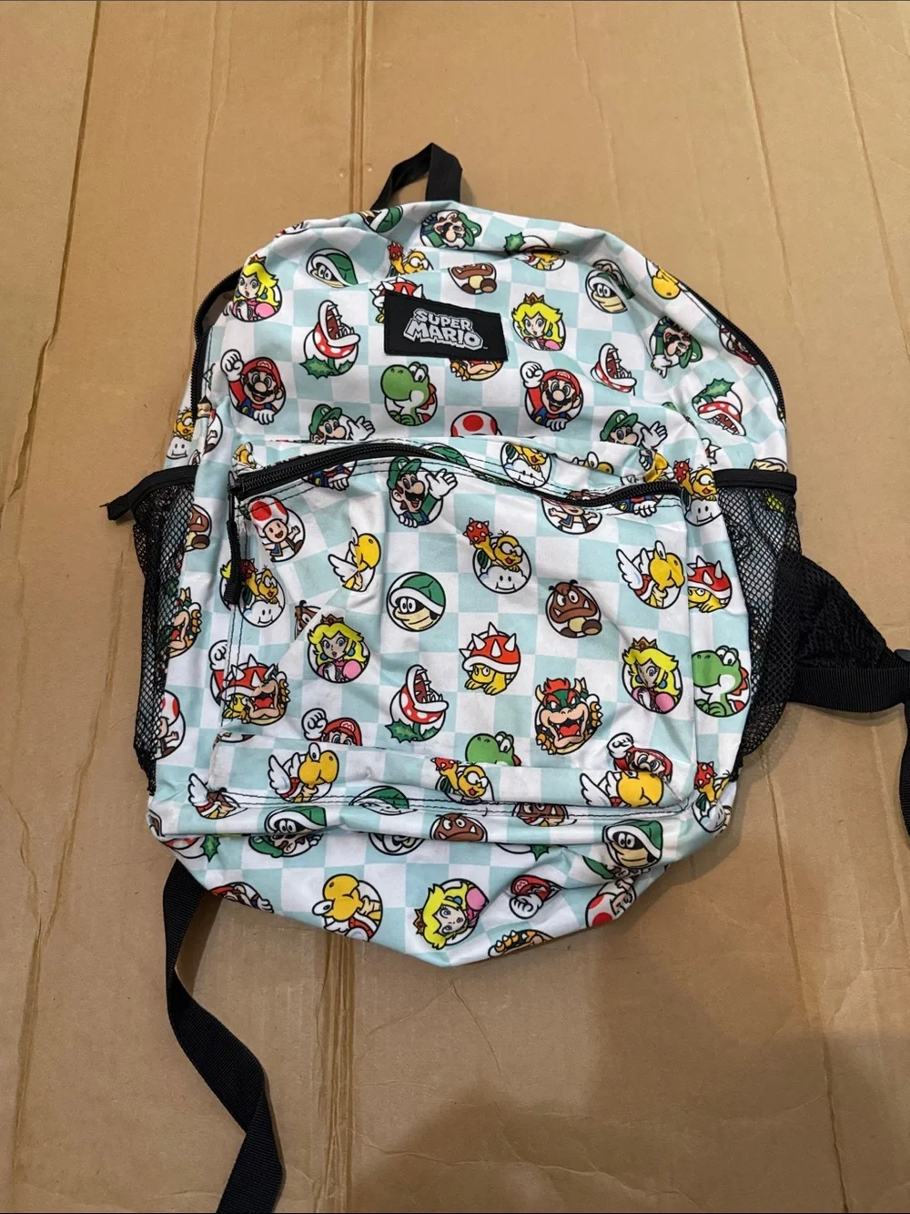 Nintendo Super Mario Kids Backpack in Light Blue and Black with Character Icons