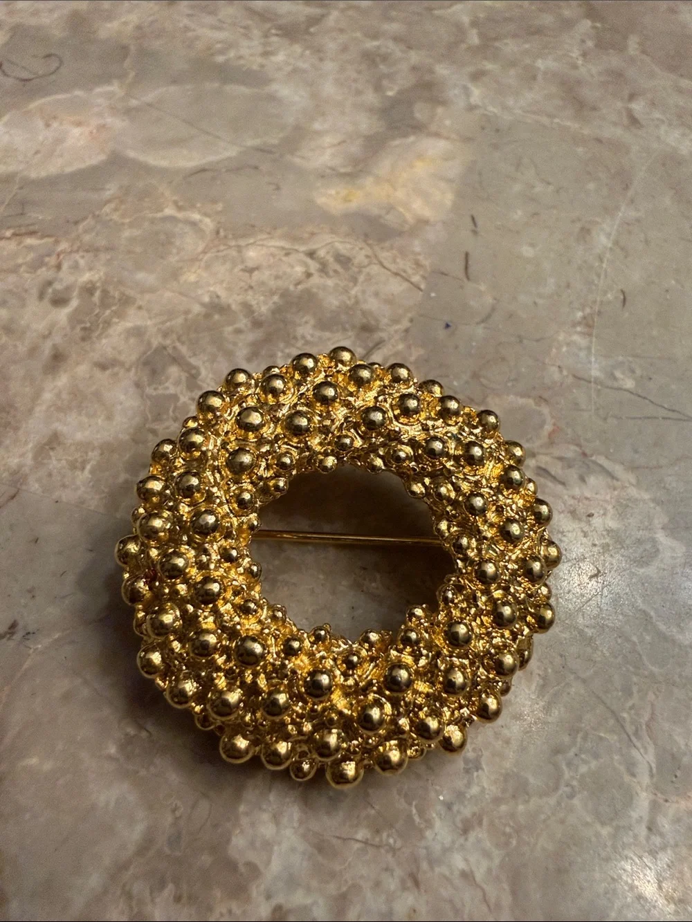 Vintage Anne Klein Circle brooch with texture gold tone