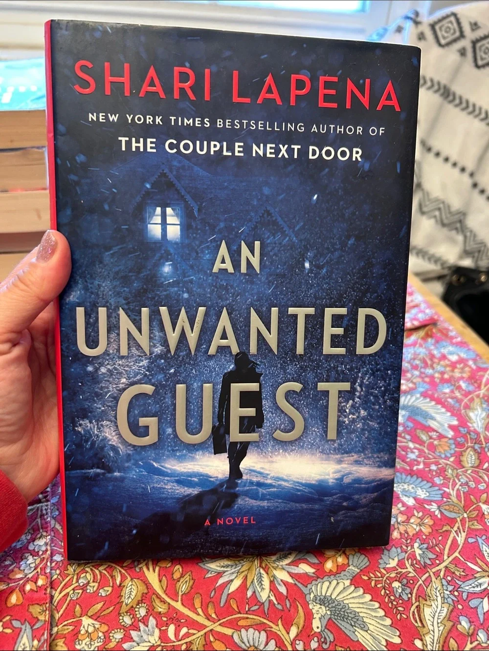 An Unwanted Guest by Shari Lapena Blue Hardcover Novel