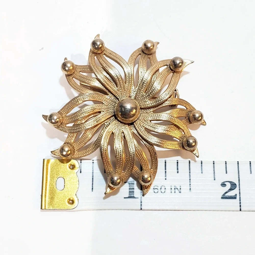 Vintage Textured Gold Tone Metal MCM Floral Starburst Open Work Petal Brooch Pin