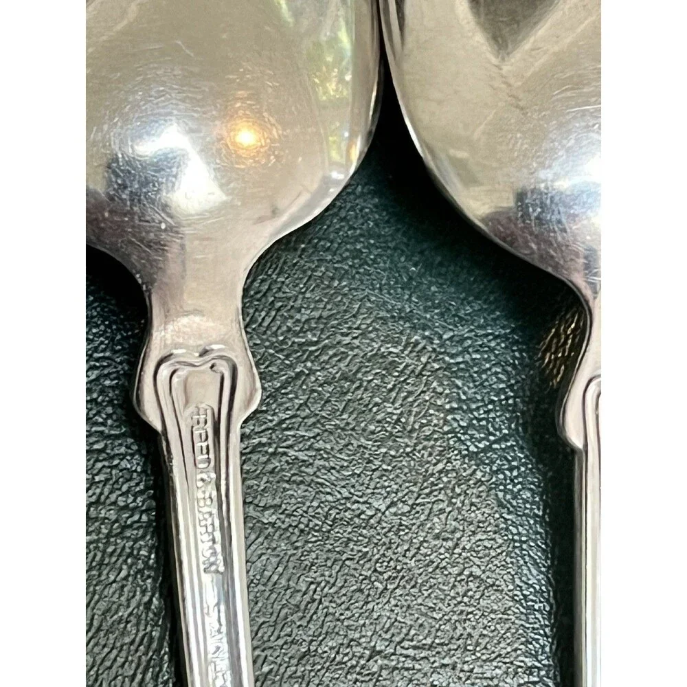 Reed & Barton Colonial Shell stainless-steel oval soup/place spoons.