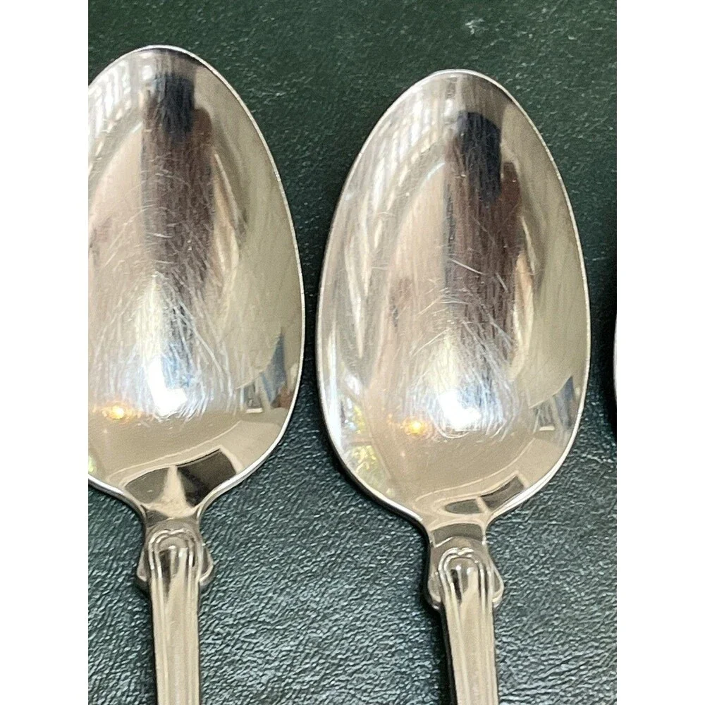 Reed & Barton Colonial Shell stainless-steel oval soup/place spoons.